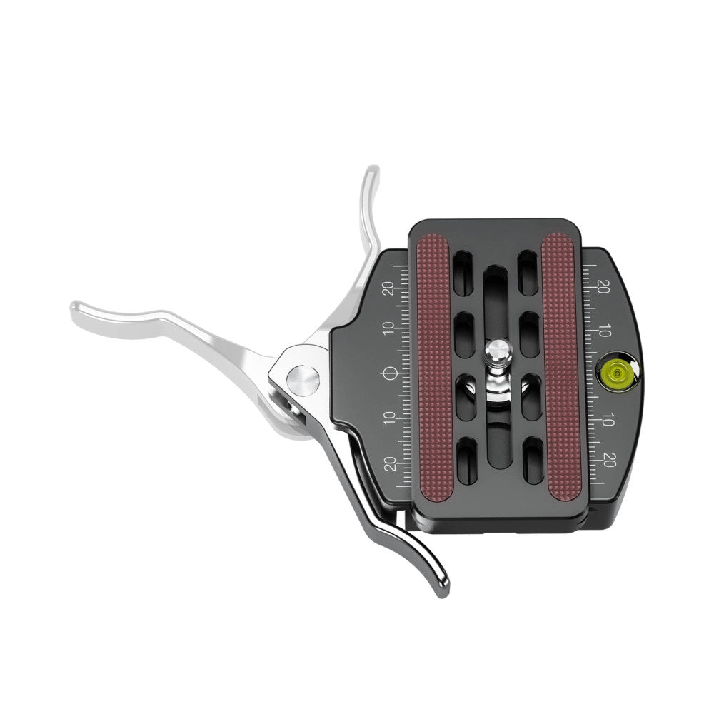 Top-down view of a grey quick release clamp with lever arm, ruler markings, and textured red pads on dark base plate with yellow level indicator.