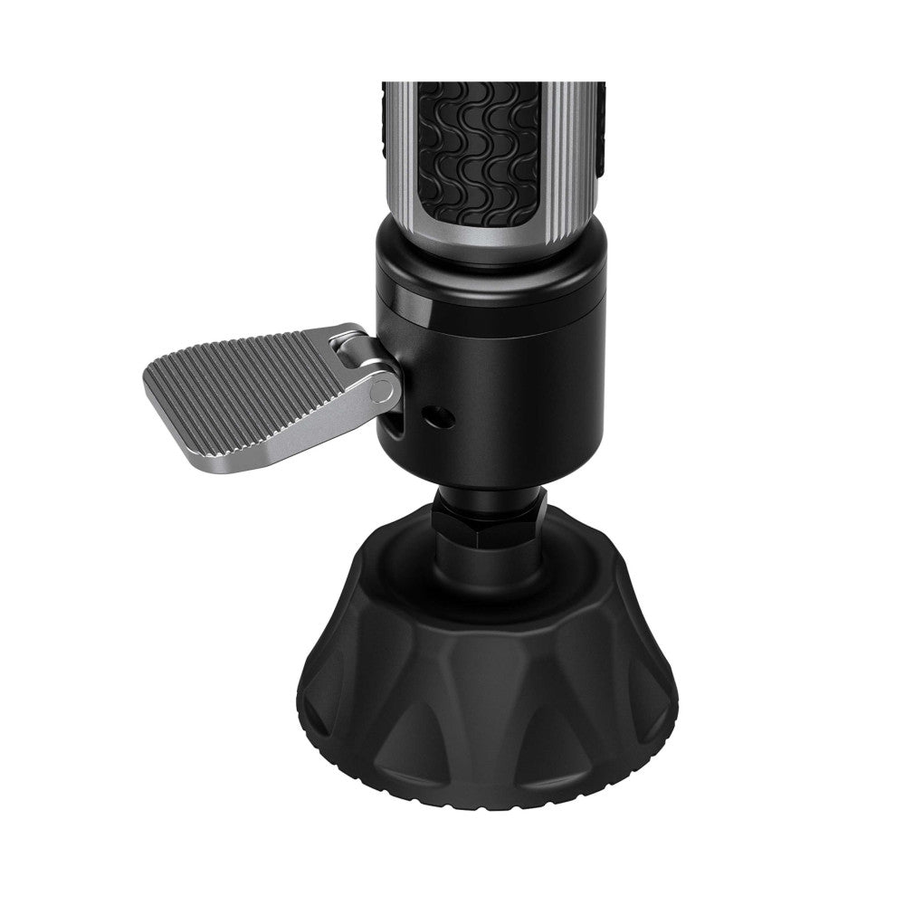 Angled product photo showing a carbon fiber monopod with gray upper shaft, black midsection, metal foot pedal, and black rubber base.