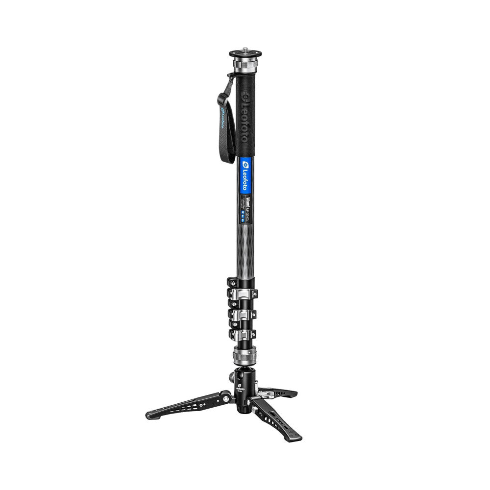 Full-length side view of a black and blue carbon fiber monopod with extended sections, fluid head, and tripod base against white background.