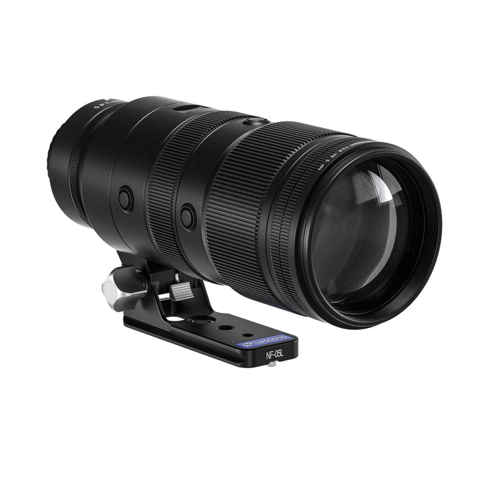 Black telephoto lens mounted on a Leofoto NF-05L Arca lens foot, shown from a side angle against a white background.