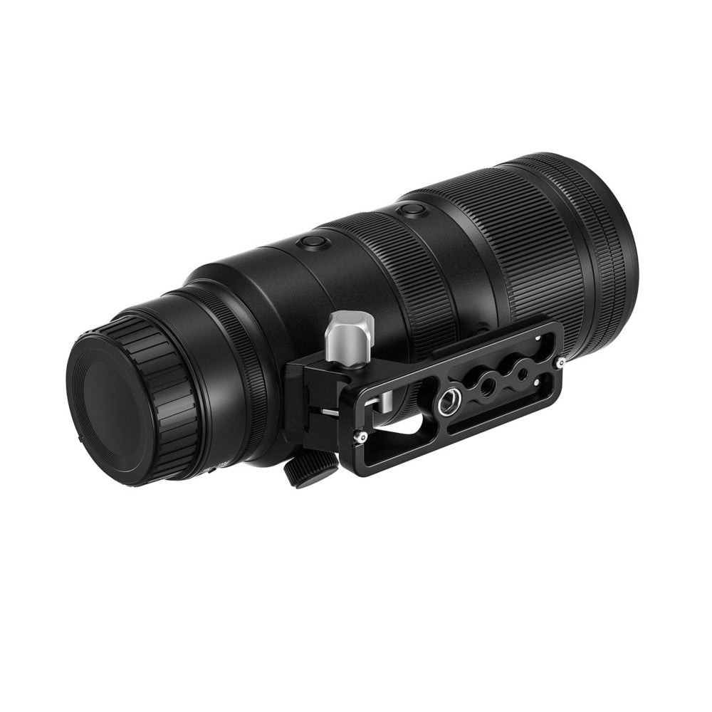 Black telephoto lens mounted on an Arca-style tripod foot plate, shown from the side at a three-quarter angle against a white background.