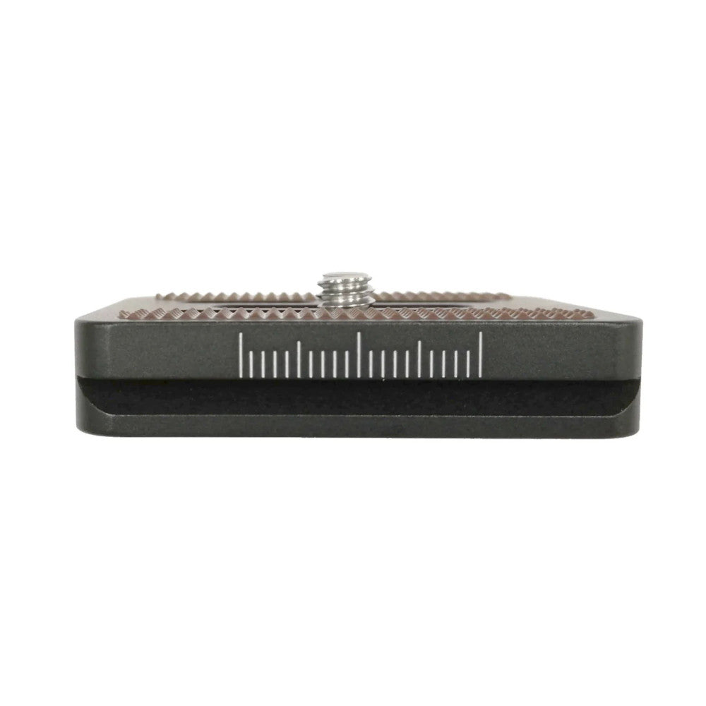 Top-down view of a black Arca Swiss quick-release plate showing the mounting surface with threaded screw and measurement scale markings.