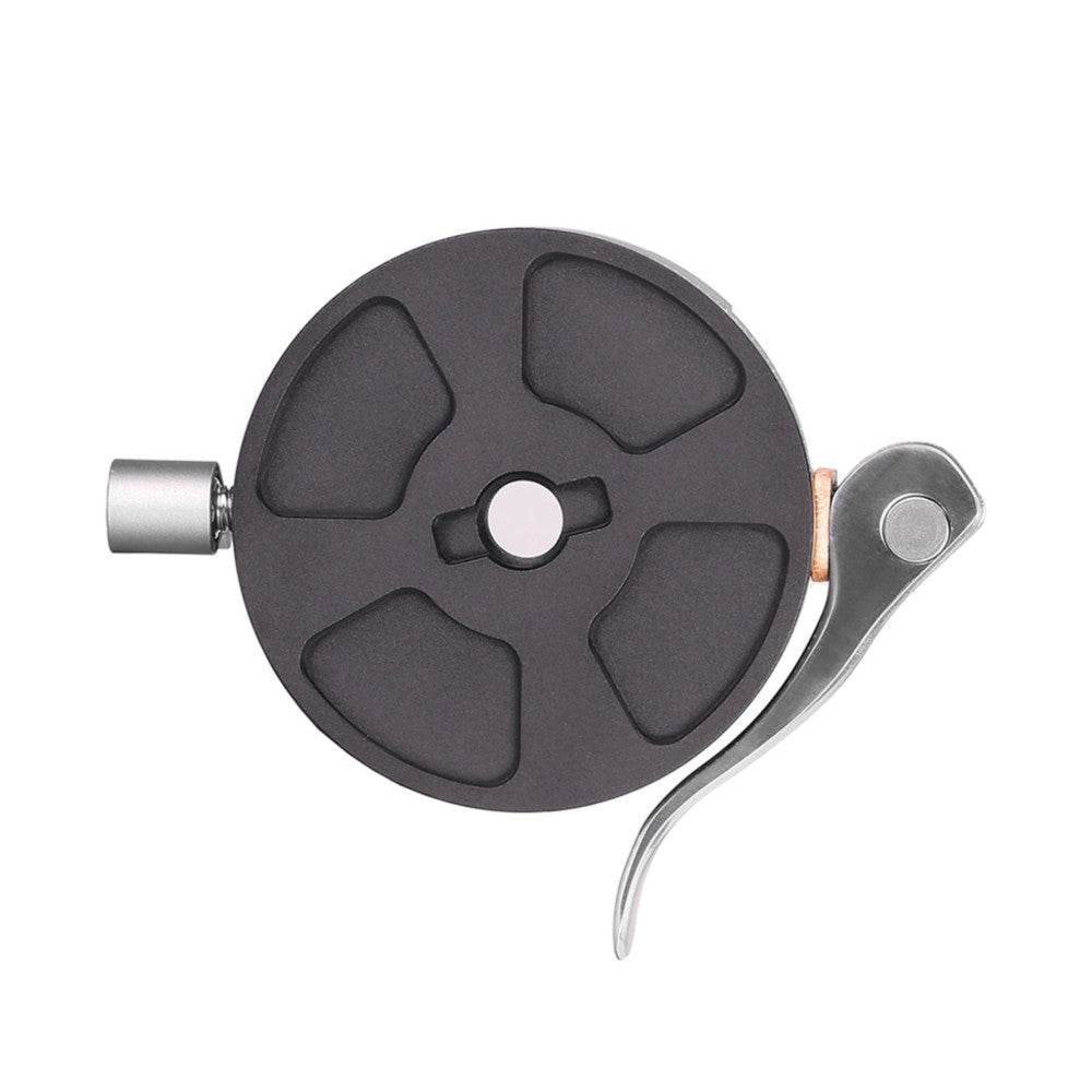 Top-down view of a black circular Arca Swiss quick-release plate with a metal lever arm extended to the right side.