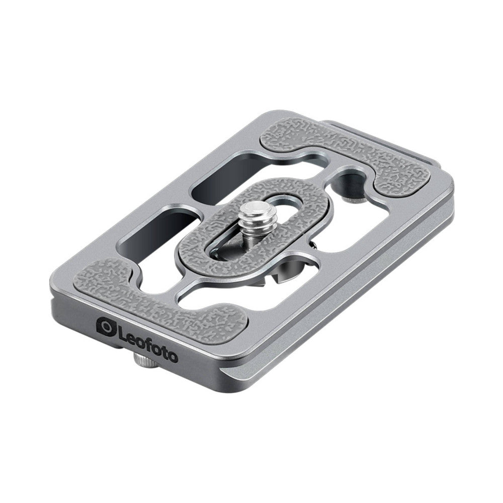 Angled view of a gray titanium quick-release camera plate with Arca Swiss compatibility, showing the mounting slot and adjustment screw.