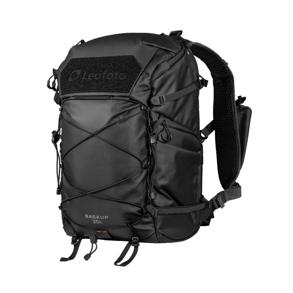 Black 25L camera backpack shown from front angle, displaying straps, zippered pockets, and MOLLE panel on chest area.