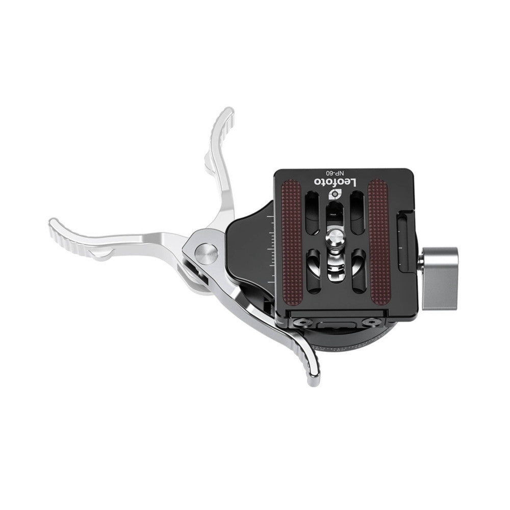 Top-down view of a camera quick-release clamp with silver levers and a black rectangular plate with red grip surfaces, shown against white background.