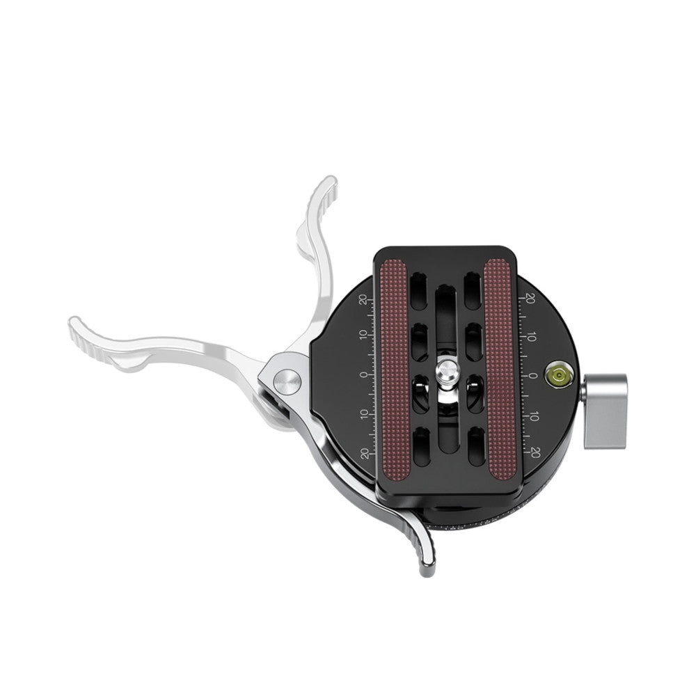 Top-down view of a black panning clamp with dual red grip pads, silver lever handles, measurement scales, and a cylindrical attachment point on the right side.