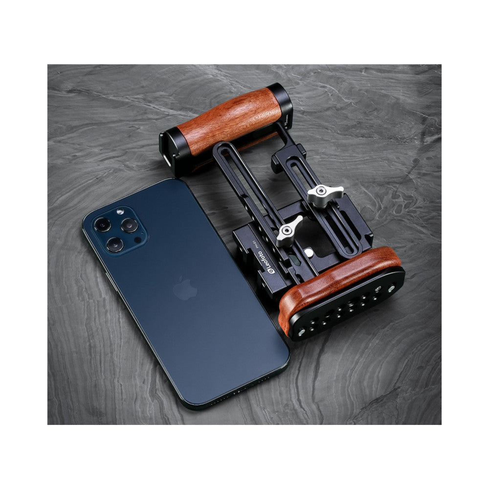 Leofoto PH-01 cage kit displayed flat with blue iPhone and wooden handles on dark textured surface, top view.