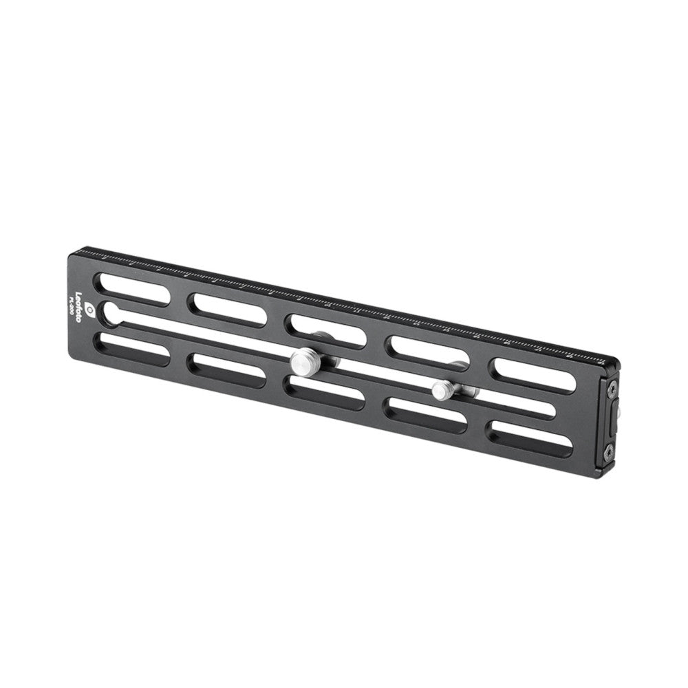 Black anodized Arca Swiss plate with elongated slots and adjustment knobs, photographed from an angled side view against a white background.
