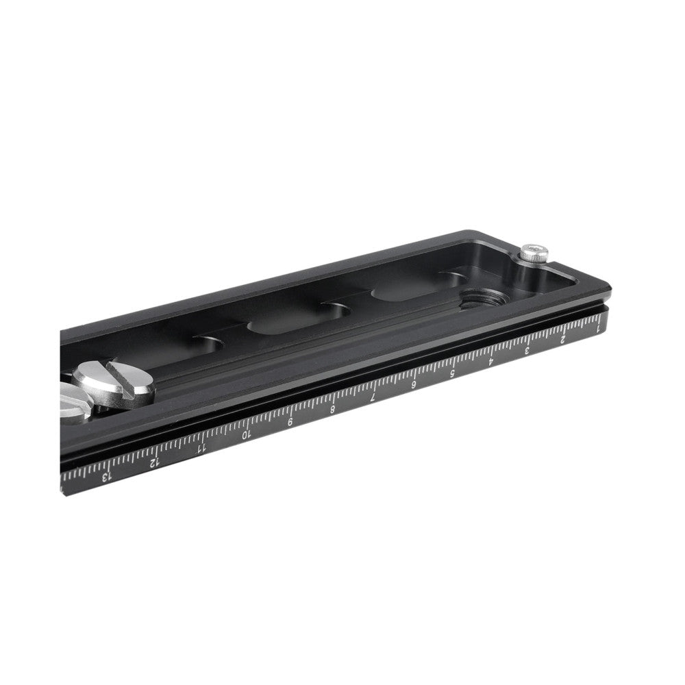 Black Arca-Swiss quick release plate shown at angle, displaying ruler measurements, adjustment knobs, and mounting slots.