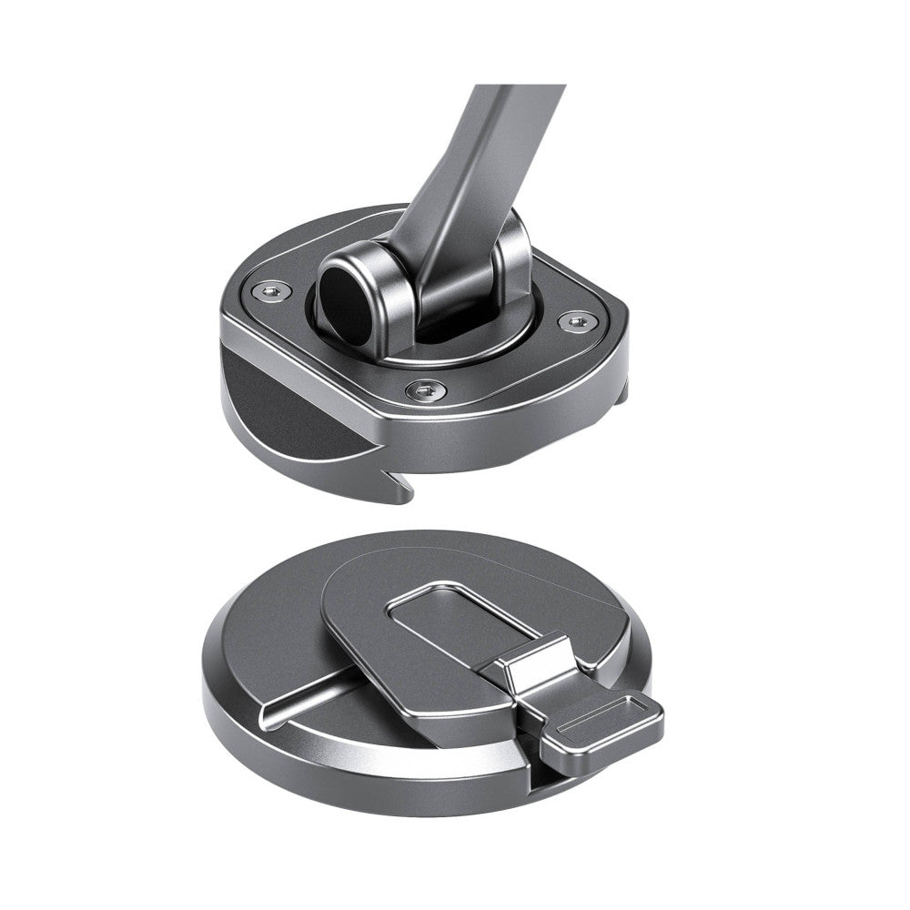 Close-up product view showing magnetic phone mount components: upper socket with ball joint connector and lower circular magnetic base plate with mounting hardware.
