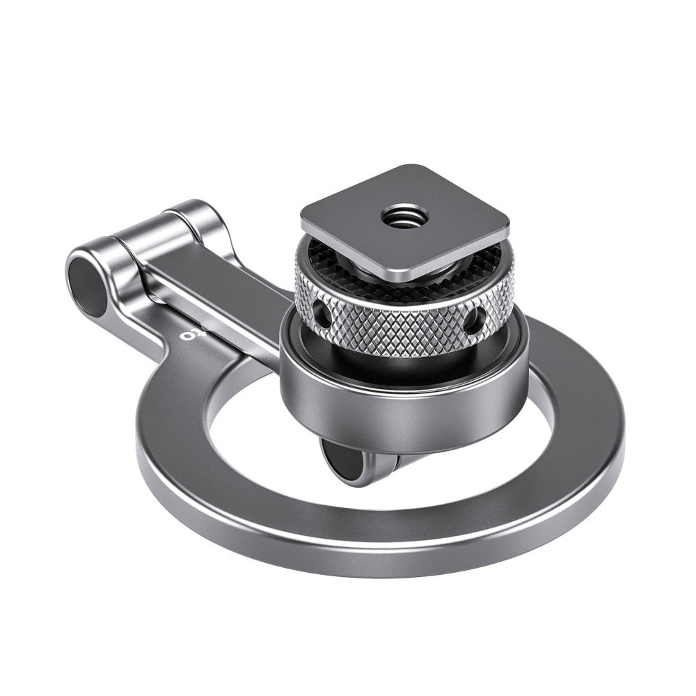 Isometric view of silver magnetic phone mount showing ball head with knurled adjustment knob, circular base plate, and cold shoe attachment arm.
