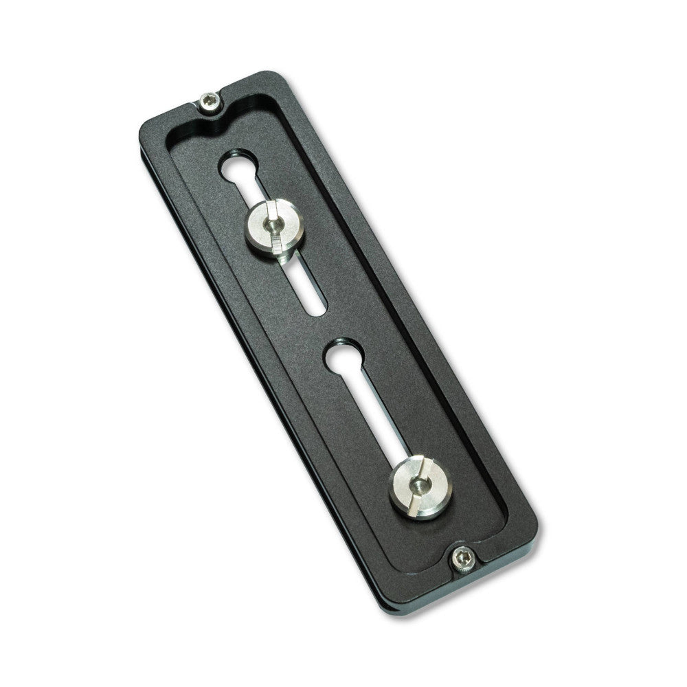 Dark gray Arca Swiss quick release plate shown from above, displaying two metal knobs connected by white stems on a textured black base with mounting holes.