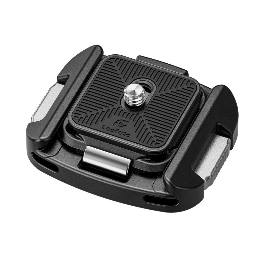 Black Leofoto QF-01 Arca-Swiss quick release clamp with metal plate and adjustment knob, photographed from angled overhead view against white background.