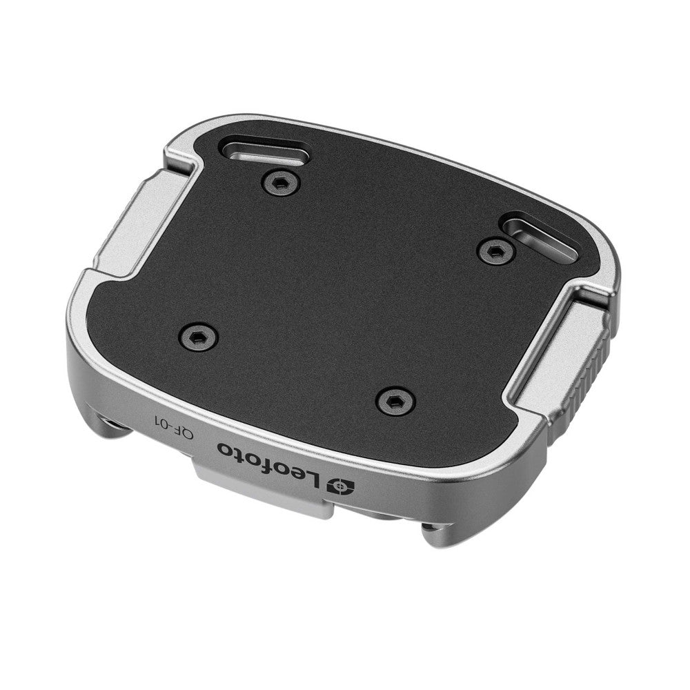Top-down view of a silver and black Leofoto QF-01 Arca-Swiss quick release clamp with mounting holes visible on the black platform surface.