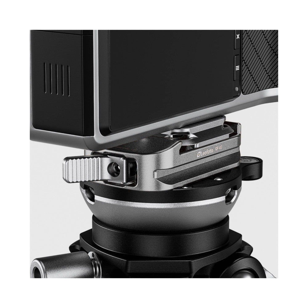 Leofoto QF-02 quick release plate mounted on tripod head with tablet mounted on top, side angle view showing the clamping mechanism and adjustment knob.