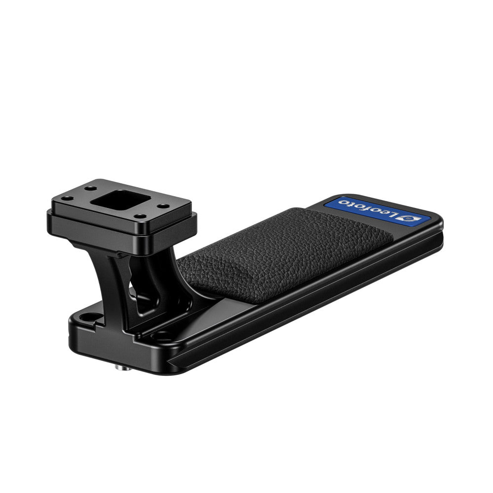 Black Arca-Swiss lens foot with mounting plate and textured grip pad, shown in side view against white background.