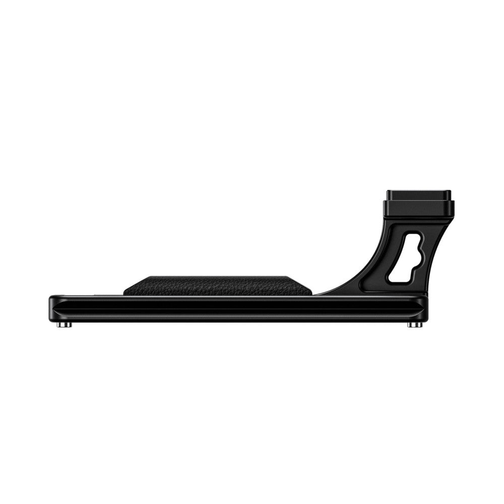 Black Arca lens foot shown from the side profile, displaying the textured grip pad and mounting bracket with cutout detail.