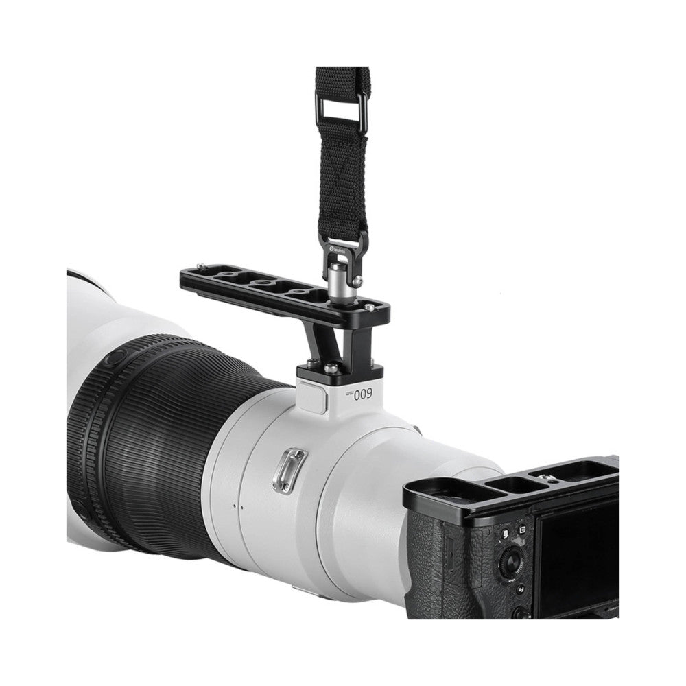 White lens foot attachment mounted on telephoto lens with black strap, shown in side angle view against white background.