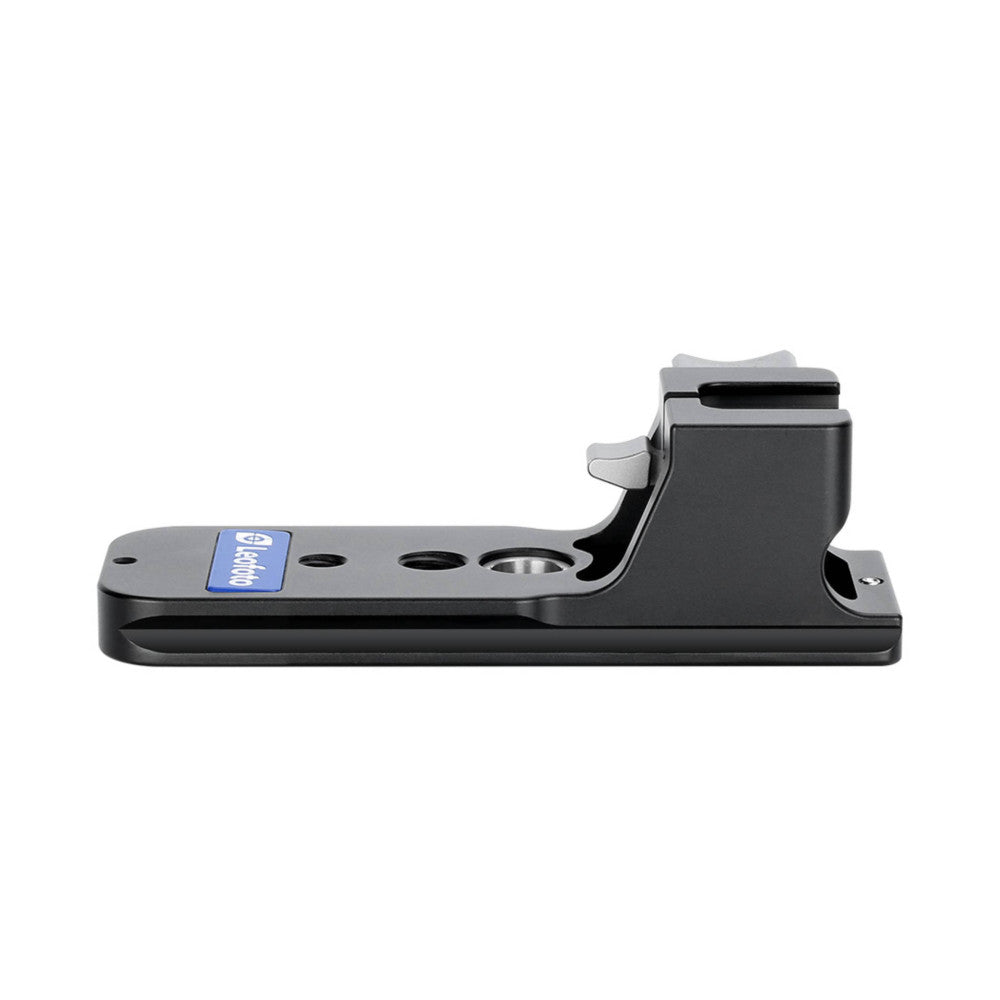 Side view of a black Arca-style lens foot with blue brand label and mounting holes, showing the angled bracket design.