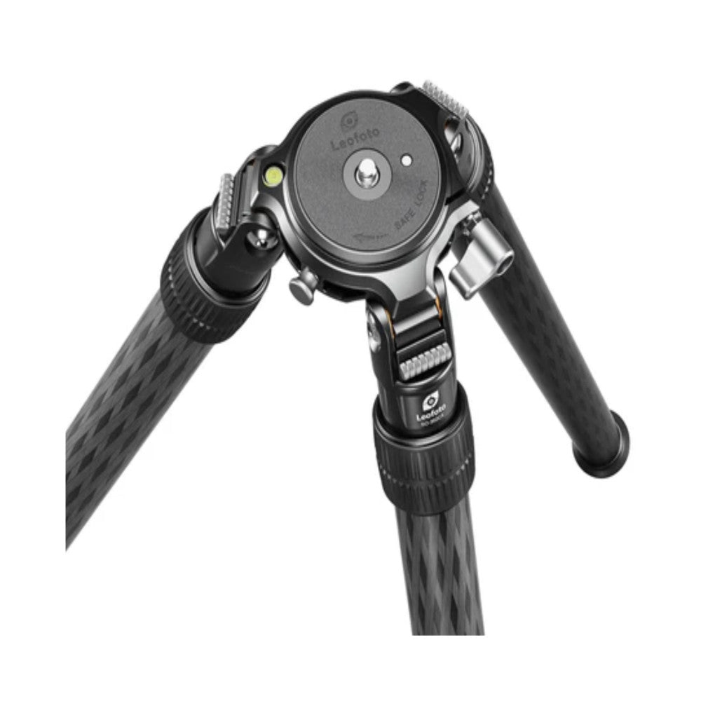 Close-up overhead view of a carbon fiber tripod head with 75mm bowl mount, showing the ball head mechanism and leg details against a white background.
