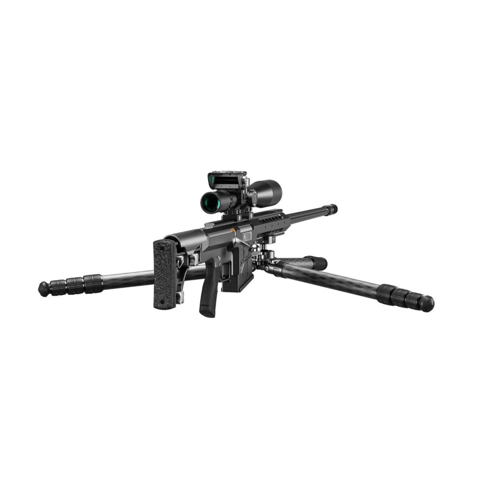 Black tactical rifle with mounted scope and thermal imaging device on carbon fiber tripod with three extended legs, shown from side angle against white background.