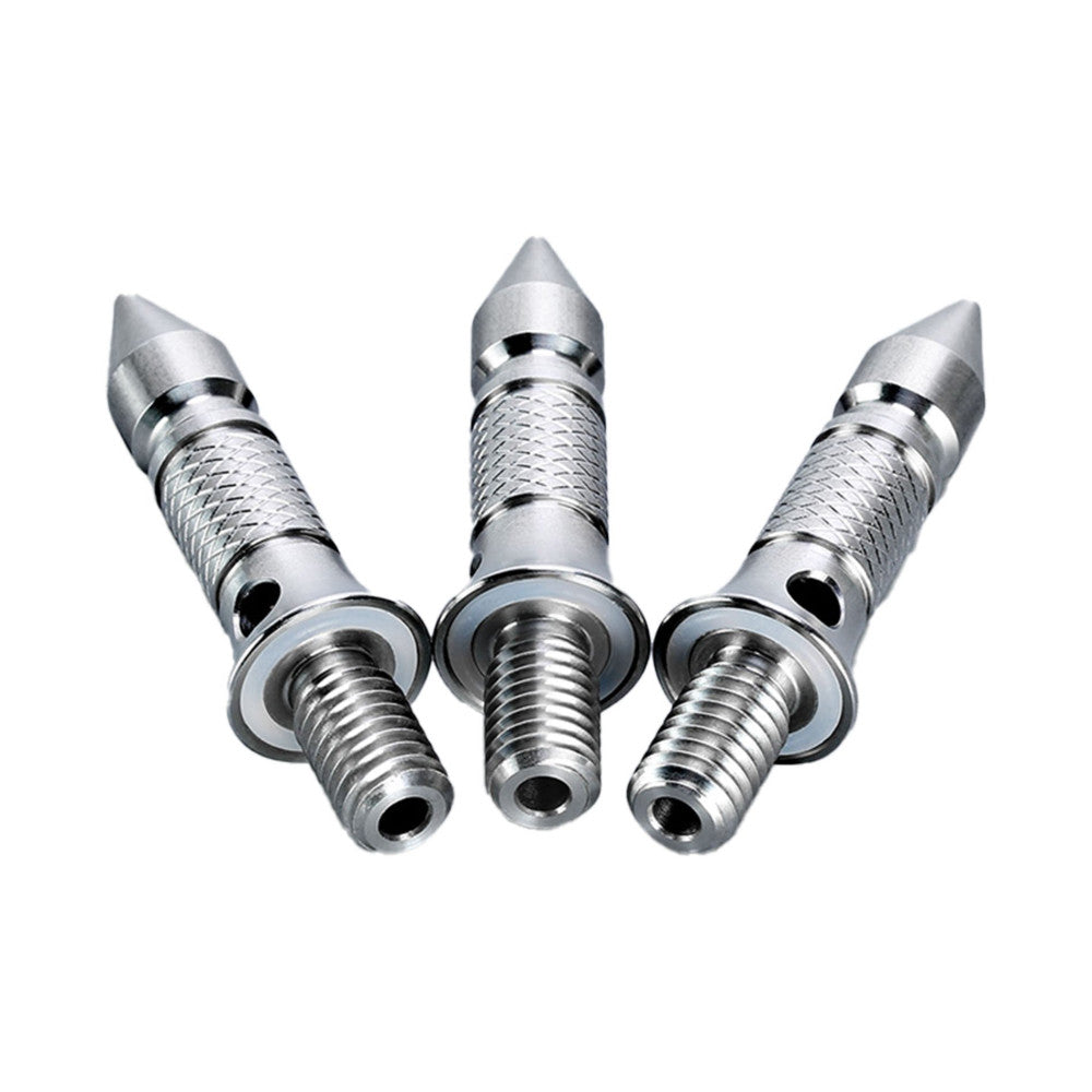 Three stainless steel tripod spikes arranged in a fan pattern against a white background, showing conical tips and textured grip sections with threaded bases.