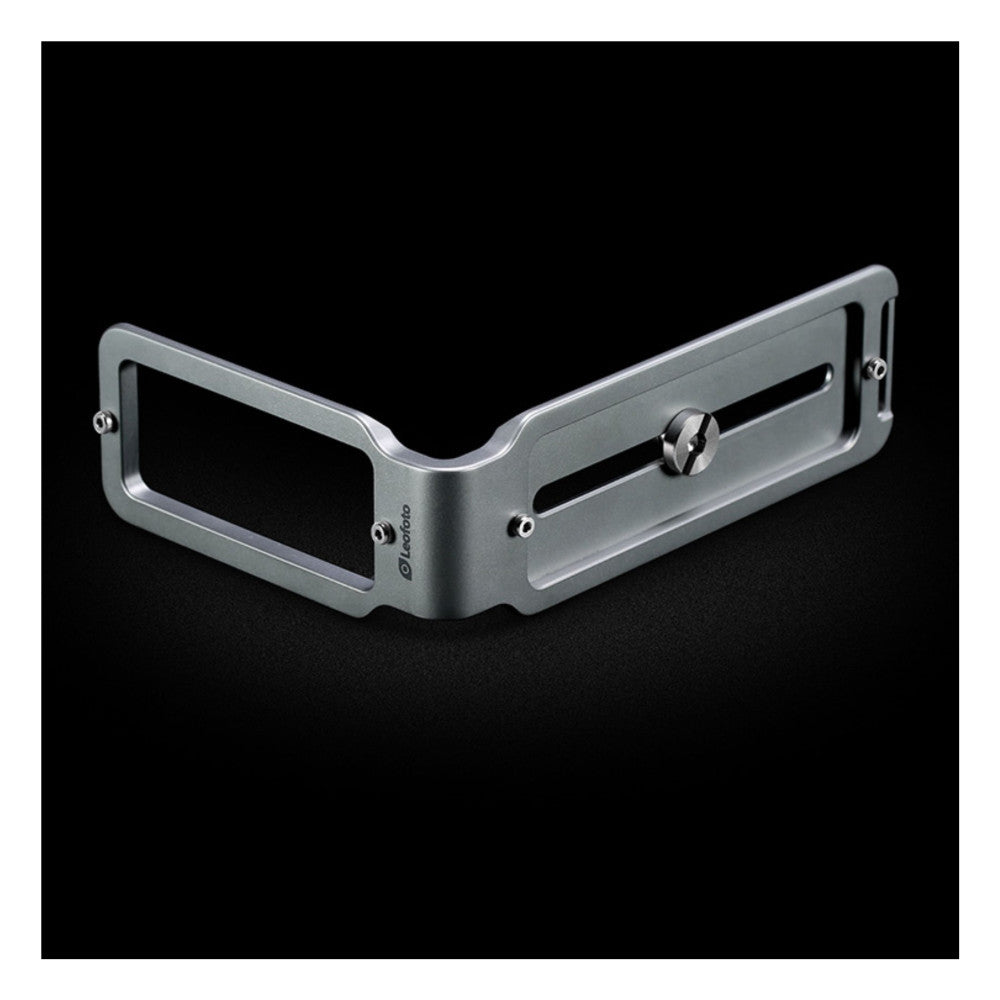 Angled three-quarter view of a silver titanium L-shaped bracket with mounting slots and adjustment screws against a black background.