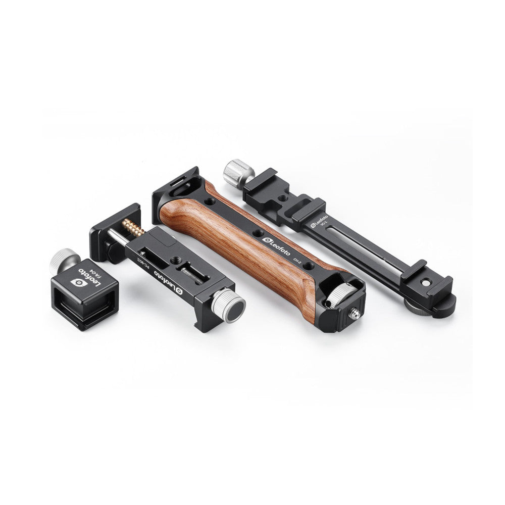 Leofoto VC-1 kit components displayed in angled view showing wooden handgrip, mounting brackets, clamps, and accessories arranged in a line against white background.