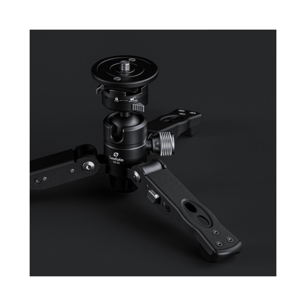 Leofoto VD-03 monopod head with ball joint and quick release plate, shown at angle with extending legs visible against dark background.