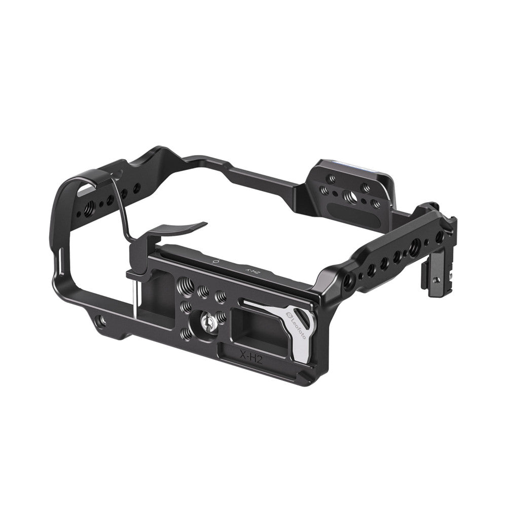 Black aluminum camera cage with multiple mounting points and handles shown from a three-quarter view against white background.
