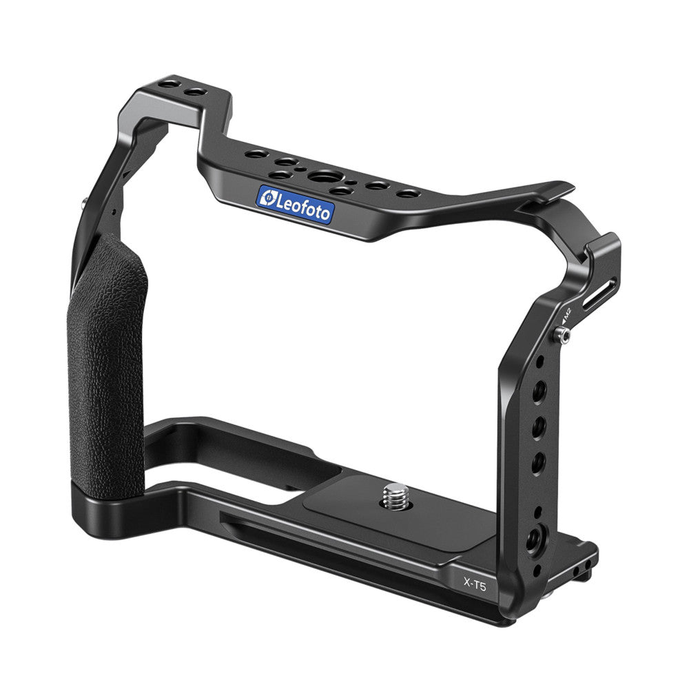 Black metal camera cage with textured grip handle on left side and top accessory rail, labeled Leofoto X-T5, shown from three-quarter angle view.