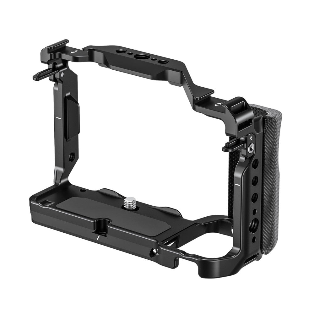 Black metal camera cage with top handle and right-side grip, shown in three-quarter view against white background.