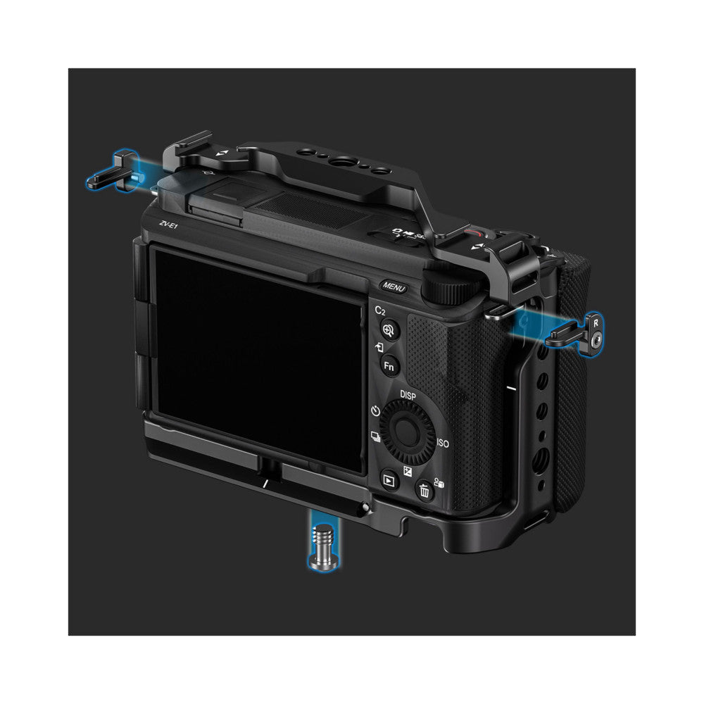 Black camera cage with blue attachment points shown from three-quarter view, displaying top, side, and bottom mounting options for Sony ZV-E1.