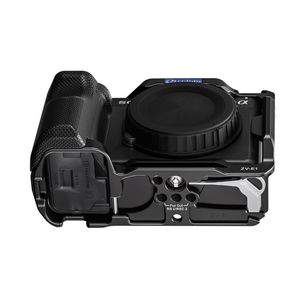 Top-down view of a black camera cage rig with attached microphone mount for Sony ZV-E1, showing mounting points and DJI gimbal compatibility.