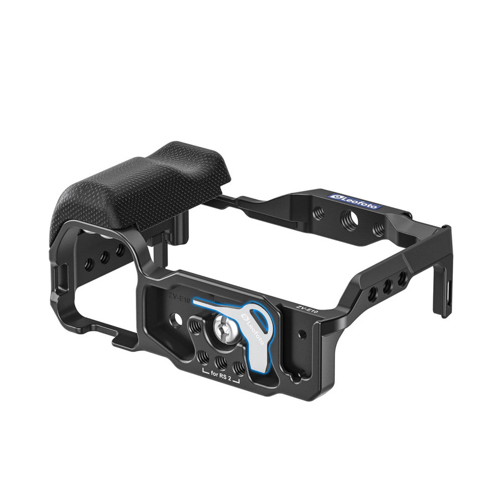 Black aluminum camera cage with blue accents for Sony ZV-E10, shown at three-quarter angle with foam grip handle and mounting points visible.