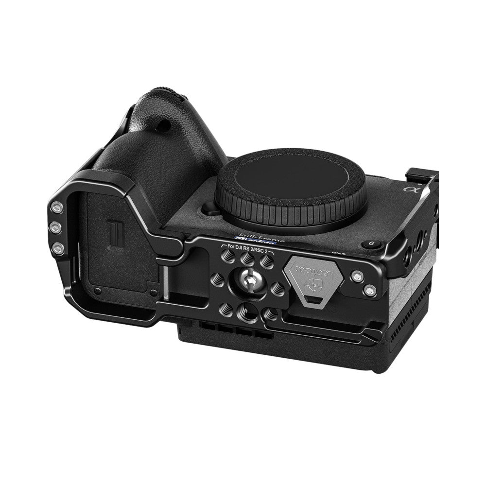 Black camera cage with top handle and control knobs, shown in three-quarter view against white background.