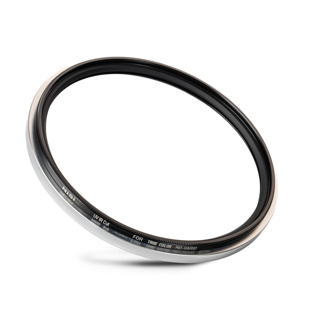 Angled side view of a circular camera filter with metallic silver and black bands, showing the NiSi branding and UV IR-Cut filter specifications printed on the edge.