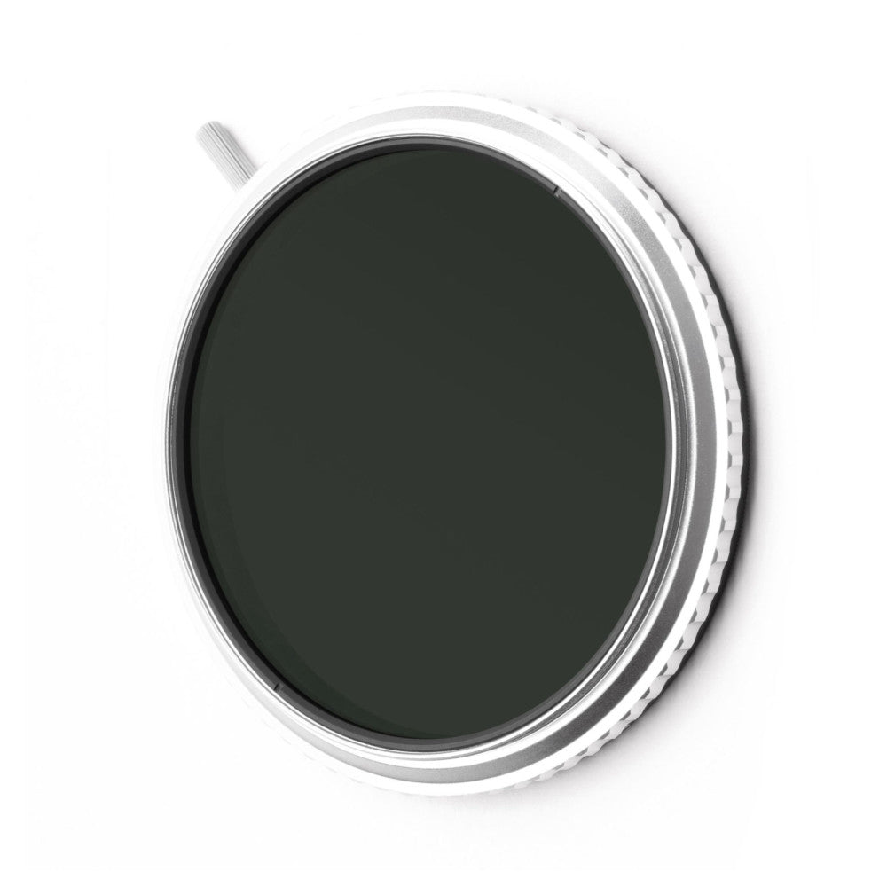 Angled view of a 72mm circular camera filter with white and gray ribbed casing and dark tinted glass element, shown against white background.