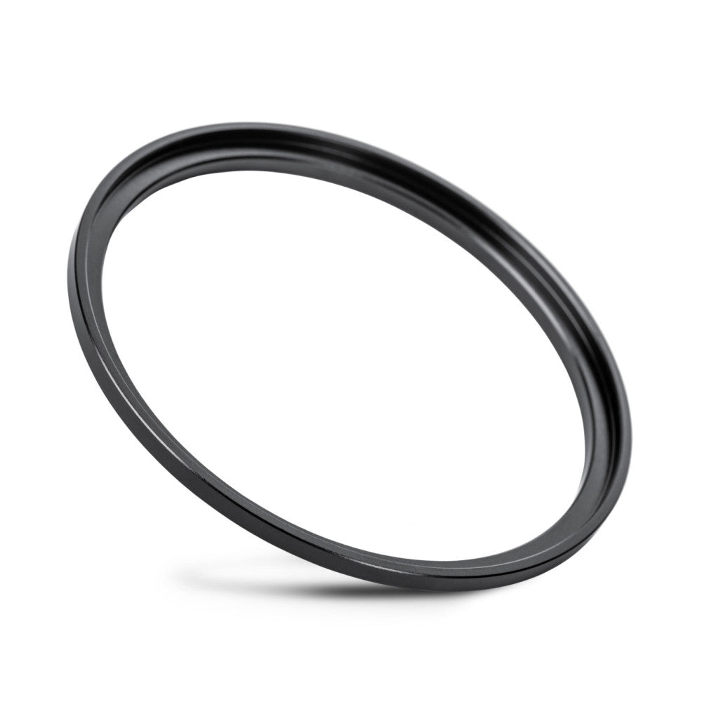 Black circular filter ring photographed at an angle against a white background, showing the beveled edge and matte finish detail.