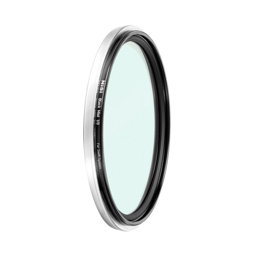 Angled view of a circular camera filter with white outer ring and dark inner frame, showing the light blue-tinted glass element and text markings on the rim.