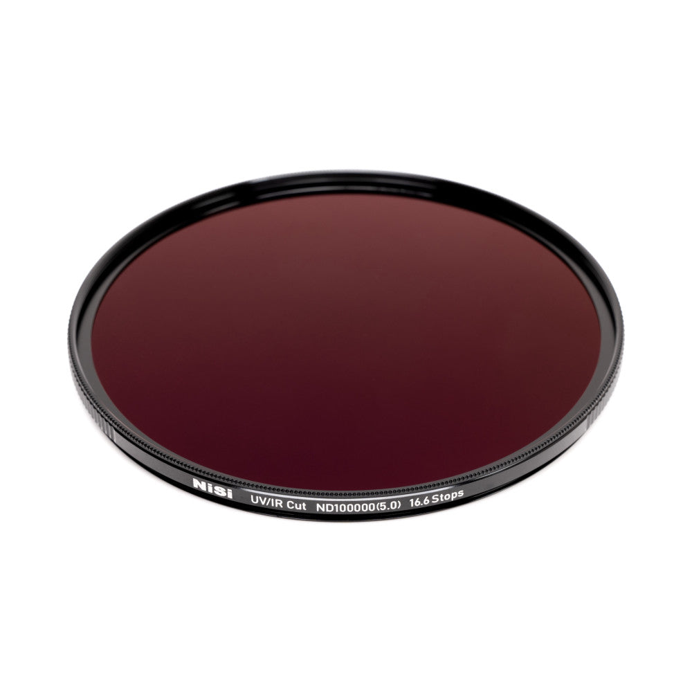 Circular dark red glass filter with black aluminum rim showing product specifications and branding on the edge, photographed from above at an angle.