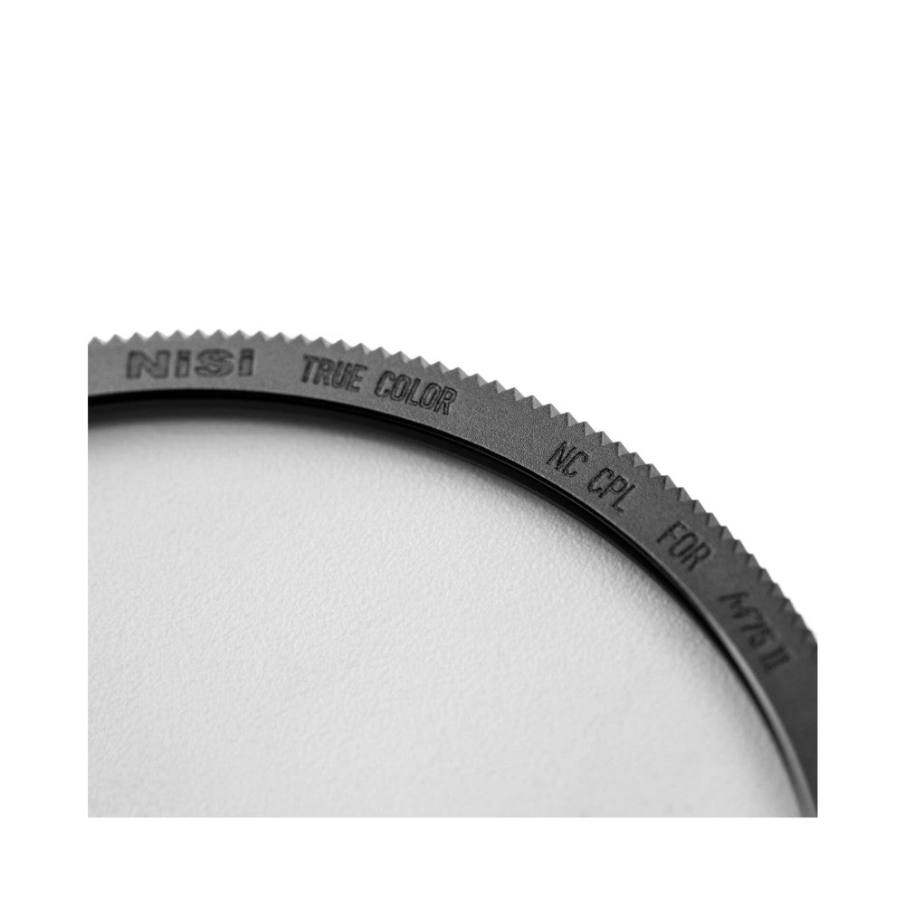 Close-up detail of NiSi filter holder rim showing engraved text and serrated edge against white background