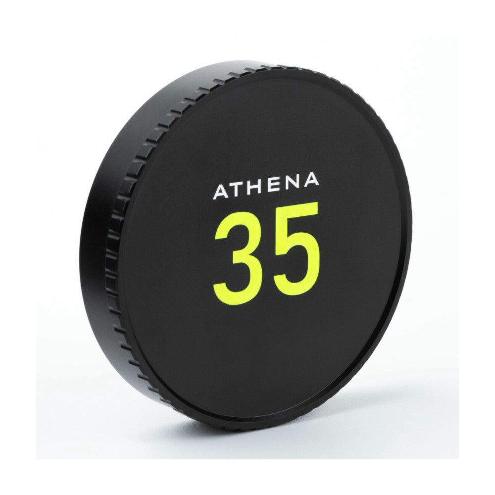 Black circular lens cap with "ATHENA 35" in neon yellow text, shown at a slight angle against white background.