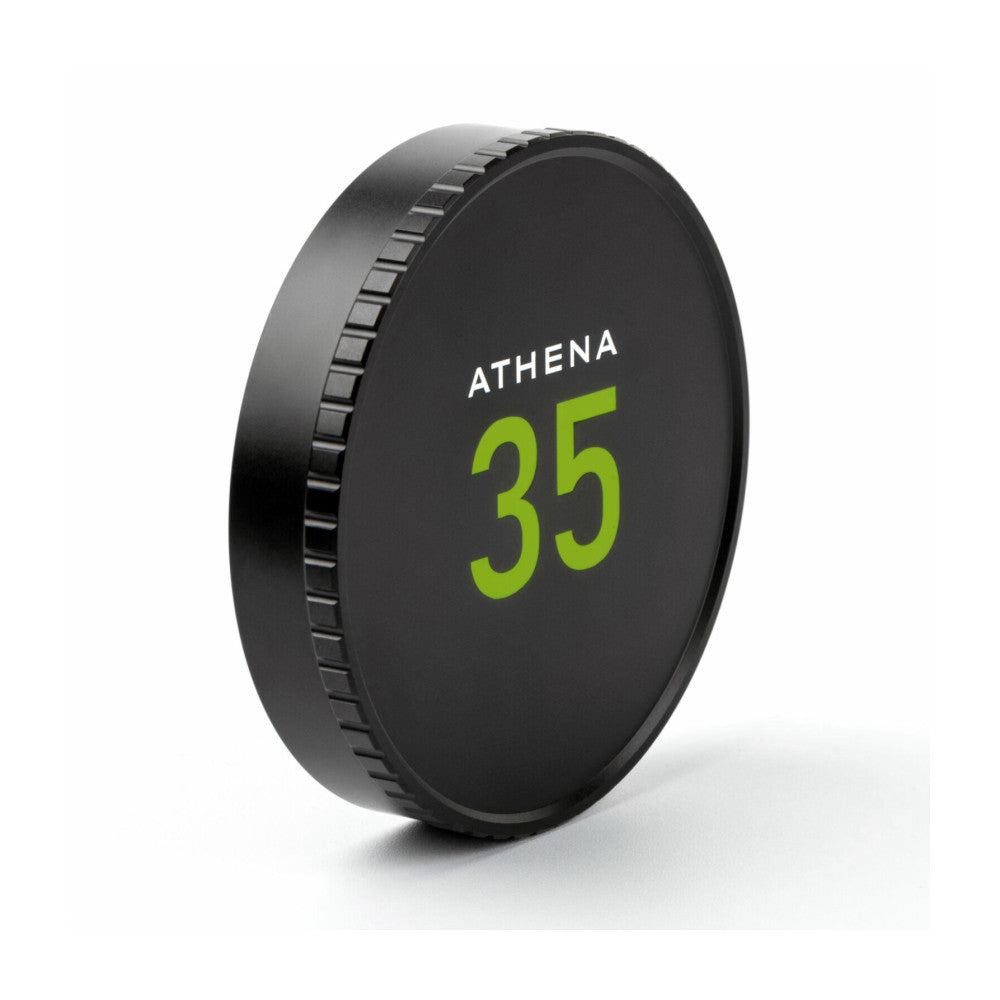 Black circular lens cap with "ATHENA 35" in white and lime green text, shown at an angle displaying the ribbed edge and flat front face.