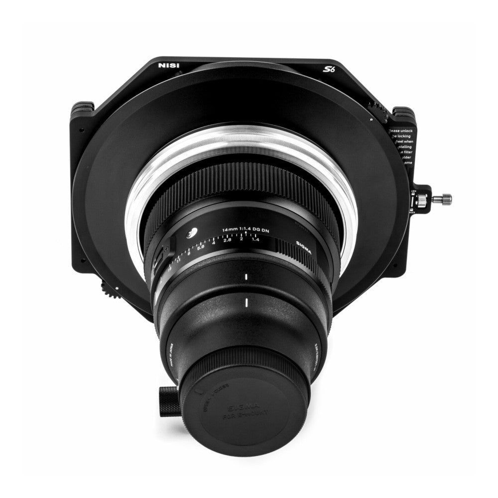 Top-down view of NiSi S6 filter holder mounted on Sigma 14mm lens, showing stacked filter rings and adapter components in black and white.