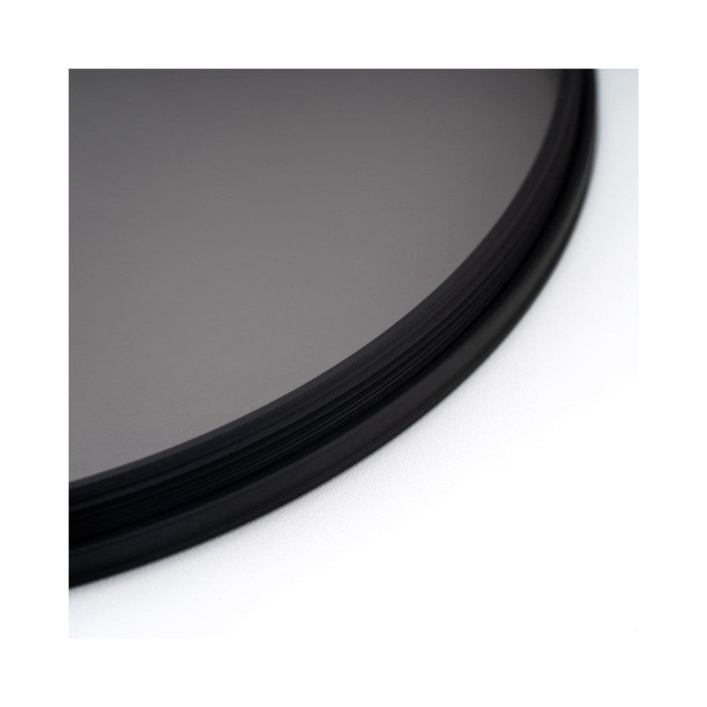 Close-up detail of black filter holder ring showing curved edge and grooved texture against gray and white background