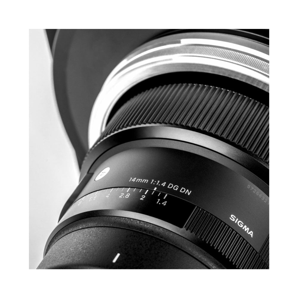 Close-up side view of a Sigma 14mm f/1.4 DG DN lens showing the adapter ring with aperture scale markings and white metal trim rings.