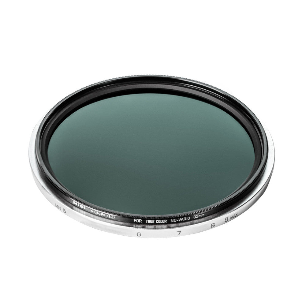Angled front view of a circular ND filter showing the dark teal glass element and numbered adjustment ring from 5 to 9 MAX on the white barrel.