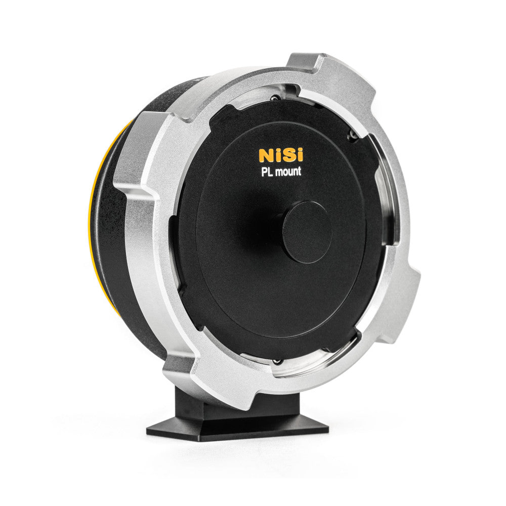 NiSi PL mount adapter shown from front angle displaying silver metal housing with black center mount and yellow accent stripe on side.